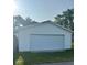 Detached garage with a large door and ample space for vehicles and storage at 1006 Hurricane St, Franklin, IN 46131