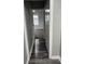 Hallway features gray wood flooring and leads to a room with new carpet and updated windows at 1006 Hurricane St, Franklin, IN 46131