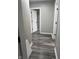 Hallway with gray hardwood flooring and light gray walls at 1006 Hurricane St, Franklin, IN 46131