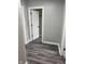 Hallway features modern gray flooring and neutral walls with white trim at 1006 Hurricane St, Franklin, IN 46131