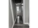 Hallway featuring new vinyl flooring, neutral paint, and a window at the end of the hall at 1006 Hurricane St, Franklin, IN 46131