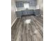 Updated kitchen with blue cabinets, white subway tile, and new hardwood floors at 1006 Hurricane St, Franklin, IN 46131