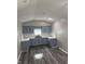 Bright kitchen features painted gray cabinets, white countertops, and modern fixtures at 1006 Hurricane St, Franklin, IN 46131