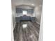 Bright kitchen features painted gray cabinets, white countertops, and modern fixtures at 1006 Hurricane St, Franklin, IN 46131