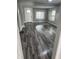 Bright living room features new gray wood flooring, fresh paint, and natural light from updated windows at 1006 Hurricane St, Franklin, IN 46131