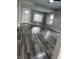 Bright living room with hardwood floors, light gray walls, and large windows at 1006 Hurricane St, Franklin, IN 46131