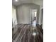 Living room featuring modern gray flooring, neutral walls, and white trim at 1006 Hurricane St, Franklin, IN 46131