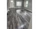 Living room showcasing windows and hardwood floors at 1006 Hurricane St, Franklin, IN 46131