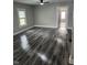 Living room with ceiling fan, hardwood floors and neutral walls at 1006 Hurricane St, Franklin, IN 46131