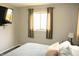 Bright bedroom featuring a television and a comfortable bed with two bedside lamps at 103 Bentwood Dr, Greenwood, IN 46143