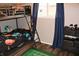 Cozy bedroom with bunk beds, dark curtains, and a sports-themed decor at 103 Bentwood Dr, Greenwood, IN 46143