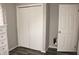 Clean bedroom showcases double closet doors, a separate door, and light gray walls at 103 Bentwood Dr, Greenwood, IN 46143
