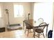 Cozy dining area featuring a wooden table with gray chairs and natural light at 103 Bentwood Dr, Greenwood, IN 46143