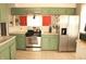 Well-lit kitchen features stainless steel refrigerator, stove, and abundant storage at 103 Bentwood Dr, Greenwood, IN 46143