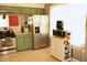 Bright kitchen with updated stainless steel appliances and green cabinets at 103 Bentwood Dr, Greenwood, IN 46143