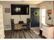 Living room featuring sleek entertainment center and a blue front door at 103 Bentwood Dr, Greenwood, IN 46143