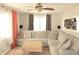 Cozy living room featuring a large sectional sofa, stylish decor, and a ceiling fan at 103 Bentwood Dr, Greenwood, IN 46143