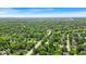An aerial view shows a lush green neighborhood from a sunny day at 108 Bennett Rd, Carmel, IN 46032
