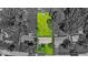Aerial view highlighting the property's expansive lot size with beautiful green grass and mature trees at 108 Bennett Rd, Carmel, IN 46032