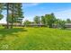 Sprawling backyard featuring lush green grass and mature trees, perfect for outdoor activities and relaxation at 108 Bennett Rd, Carmel, IN 46032