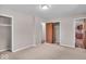 Cozy bedroom featuring neutral carpet, fresh paint, and ample closet space at 108 Bennett Rd, Carmel, IN 46032