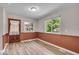 Bright dining room features new flooring, fresh paint and two large windows at 108 Bennett Rd, Carmel, IN 46032