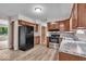 Efficient kitchen featuring sleek, stainless-steel appliances and granite countertops at 108 Bennett Rd, Carmel, IN 46032