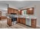 Beautiful kitchen features modern appliances, granite countertops and wood cabinets at 108 Bennett Rd, Carmel, IN 46032