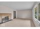 Comfortable living room with neutral walls, soft carpet and a cozy fireplace at 108 Bennett Rd, Carmel, IN 46032