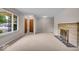 Spacious living room with neutral walls, carpet and a cozy fireplace, perfect for relaxing at 108 Bennett Rd, Carmel, IN 46032