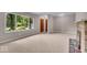 Inviting living room featuring neutral walls, carpet and a classic brick fireplace at 108 Bennett Rd, Carmel, IN 46032
