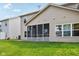 Backyard featuring lawn and a screened in porch and siding at 1138 Topp Creek Dr, Indianapolis, IN 46214