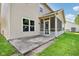 Back exterior view of a home with a well-manicured lawn and a screened-in patio at 1138 Topp Creek Dr, Indianapolis, IN 46214