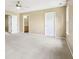 Spacious bedroom with neutral walls, carpet and a view of the en-suite bathroom at 1138 Topp Creek Dr, Indianapolis, IN 46214