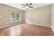 Neutral bedroom with a ceiling fan and a window with views of the yard at 1138 Topp Creek Dr, Indianapolis, IN 46214