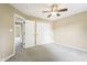 Neutral bedroom featuring ceiling fan and closet with a view to another room at 1138 Topp Creek Dr, Indianapolis, IN 46214