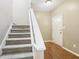 Bright entryway features wood flooring and a staircase leading to the upper level at 1138 Topp Creek Dr, Indianapolis, IN 46214