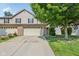 Charming two-story home with a well-manicured lawn, and an attached garage at 1138 Topp Creek Dr, Indianapolis, IN 46214