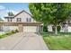 Charming two-story home with a well-manicured lawn, attached garage, and delightful red roses at 1138 Topp Creek Dr, Indianapolis, IN 46214