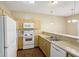 Well-lit kitchen featuring an oven, microwave, a double sink and ample counter space at 1138 Topp Creek Dr, Indianapolis, IN 46214