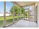 Screened-in back porch with an entry door offers outdoor relaxation and views of the backyard at 1138 Topp Creek Dr, Indianapolis, IN 46214