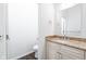 Half bathroom featuring sink with granite countertop, modern fixtures, and toilet at 1210 Churchman Ave, Indianapolis, IN 46203