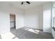 This bedroom offers soft carpet and a walk-in closet with ample storage space at 1210 Churchman Ave, Indianapolis, IN 46203