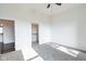Well-lit bedroom with soft carpet and access to a walk-in closet and adjoining room at 1210 Churchman Ave, Indianapolis, IN 46203