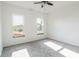 Bright bedroom featuring two windows providing natural light and plush neutral carpet at 1210 Churchman Ave, Indianapolis, IN 46203