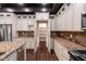 Gourmet kitchen boasts walk-in pantry, stainless appliances, granite counters, and ample cabinetry at 1210 Churchman Ave, Indianapolis, IN 46203