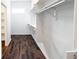 Spacious walk-in closet with modern design elements including custom shelving and hardwood floors at 1210 Churchman Ave, Indianapolis, IN 46203