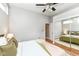 Spacious bedroom with an open closet and modern ceiling fan at 1221 Cottage Ave, Indianapolis, IN 46203