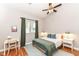 Inviting bedroom featuring a ceiling fan and a view of the natural light at 1221 Cottage Ave, Indianapolis, IN 46203