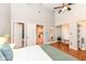 Bedroom with open closet, ceiling fan, and an open doorway at 1221 Cottage Ave, Indianapolis, IN 46203